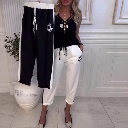 Women's cropped comfort joggers with side contrast stripes, elastic drawstring waist, and logo embroidery StylebySassy