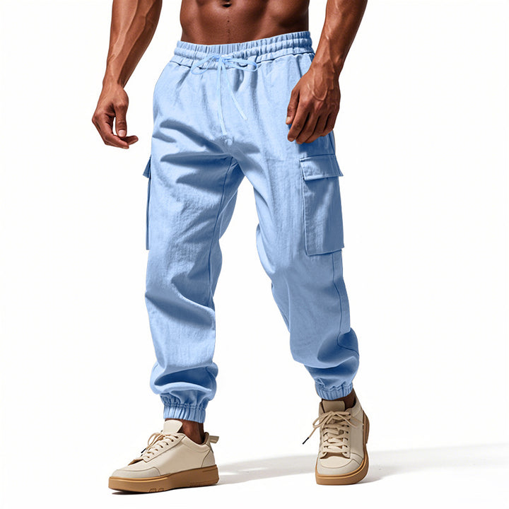 Men's tapered joggers in utilitarian style with elastic waistband, drawstring, and flap pockets StylebySassy