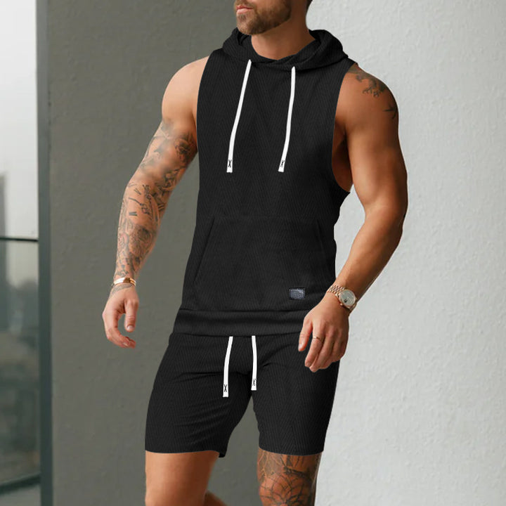 Men's sleeveless hoodie vest set made of textured cotton blend with kangaroo pocket and drawstring shorts StylebySassy