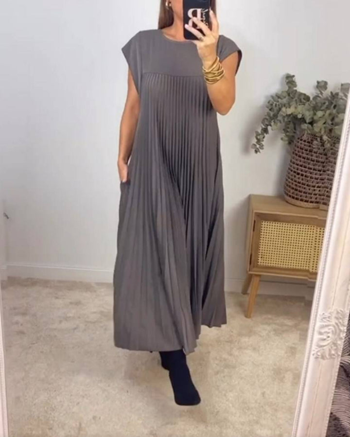 Women's flowing pleated maxi dress with dropped shoulders and side pockets StylebySassy