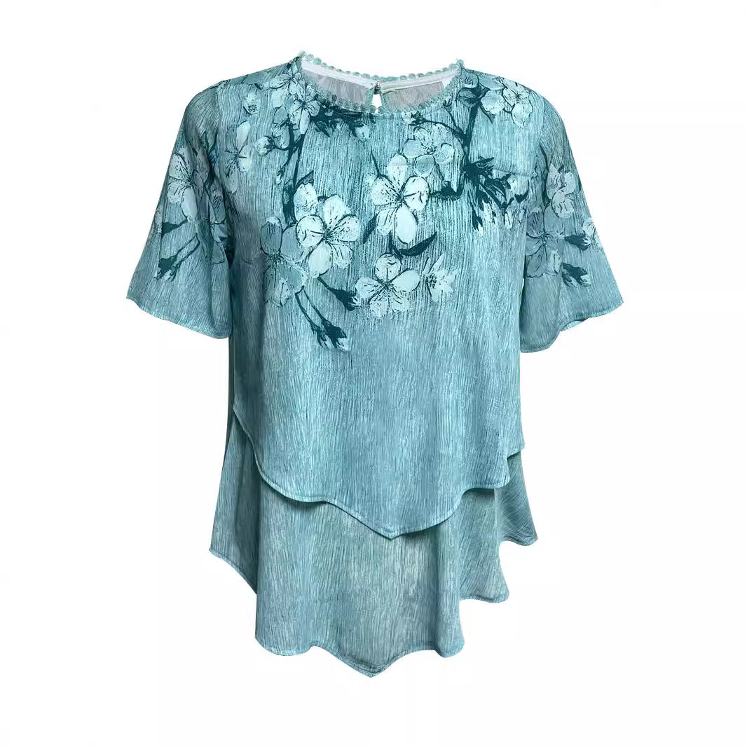 Women's two-layer blouse dress with asymmetrical tiered hem, floral print yoke, and wing sleeves StylebySassy