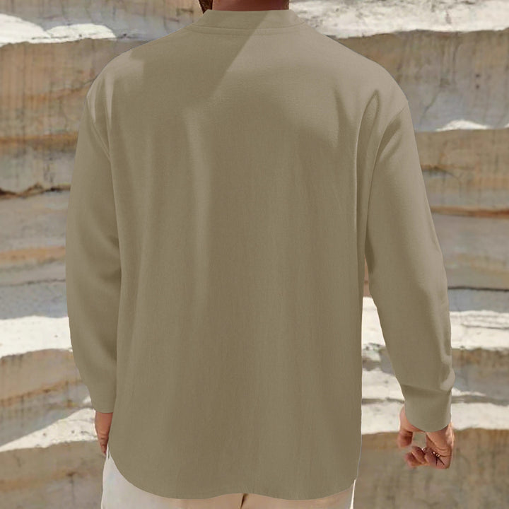 Men's loose-fitting tunic shirt with mandarin collar, two-button Henley placket, and light texture StylebySassy