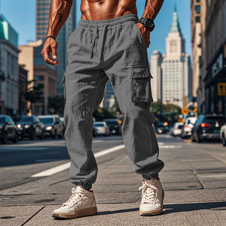 Men's sporty work-inspired joggers with patch flap pockets, elastic drawstring waistband, and gathered leg cuffs StylebySassy
