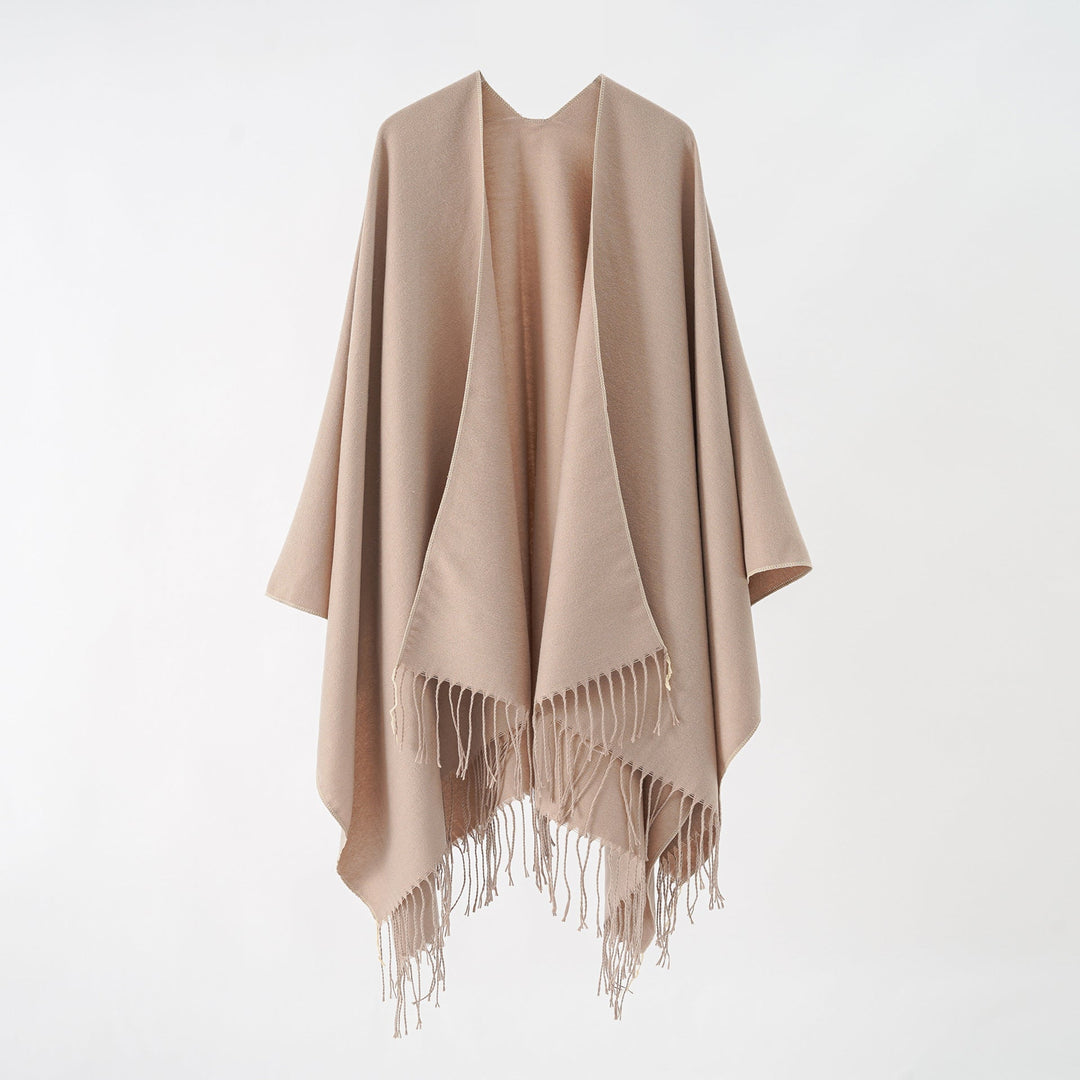 Women's fashionable fringe poncho made of soft material with luxurious drape StylebySassy
