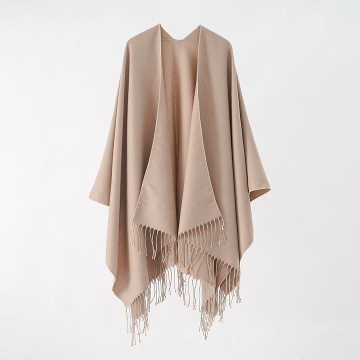 Women's fashionable fringe poncho made of soft material with luxurious drape StylebySassy
