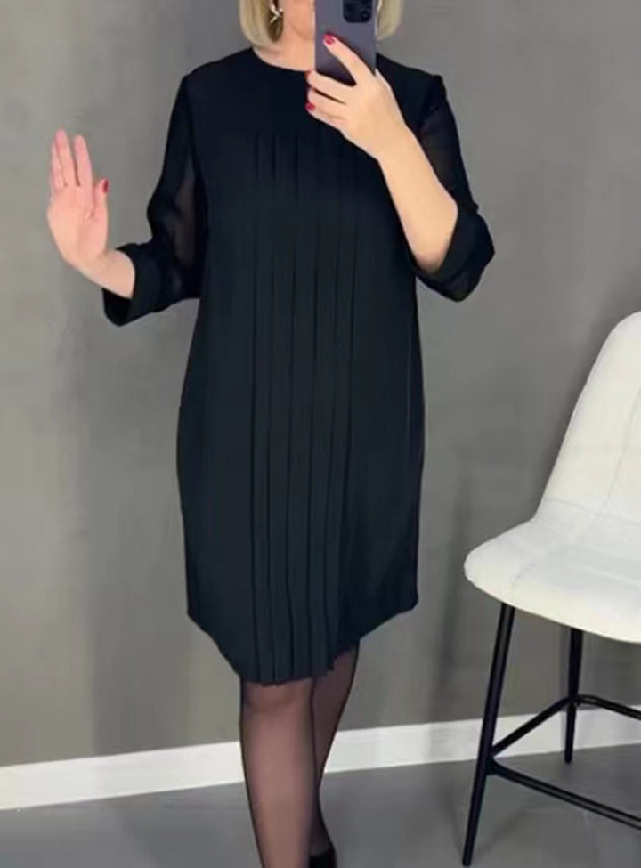 Ladies nan pleated sheath dress with knee-length silhouette and transparent three-quarter sleeves StylebySassy