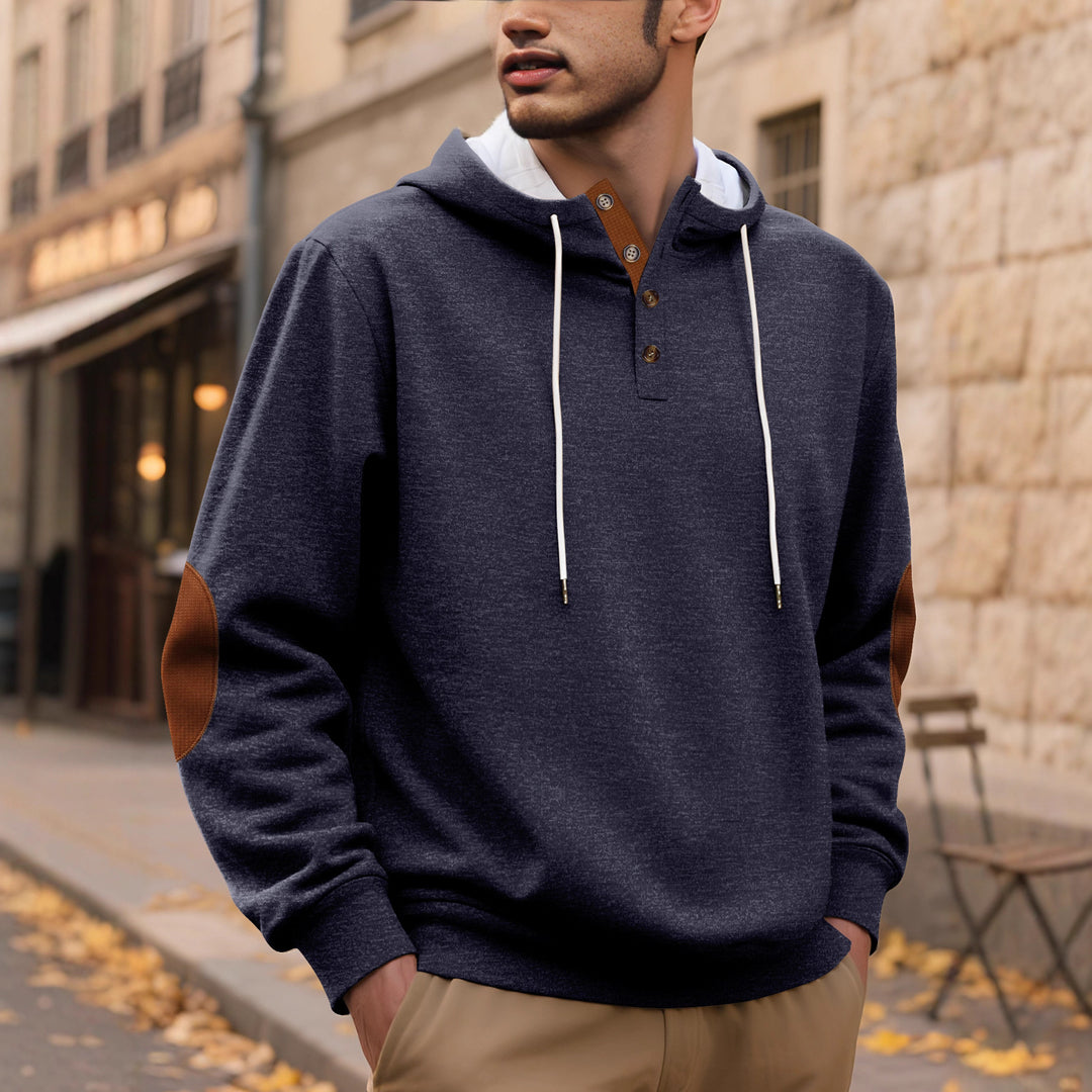 Men's hooded sweatshirt in a puristic leisure style with Henley button placket, contrasted hood interior, and elbow patches StylebySassy