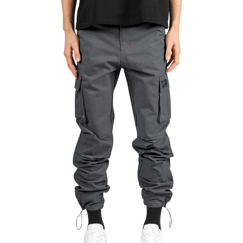 Men's multi-pocket casual trousers made of cotton twill with tapered leg and adjustable ankle drawstring StylebySassy