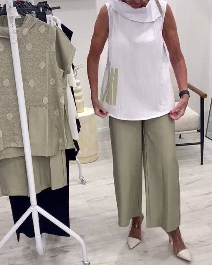 Women's sleeveless blouse top with wide shawl collar, relaxed A-line and side decorative yoke StylebySassy