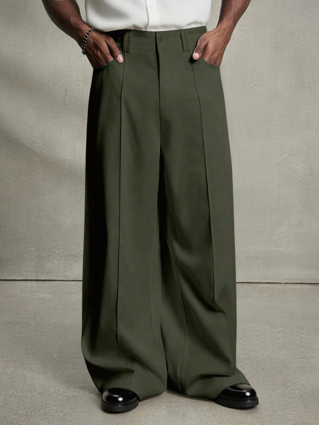 Men's wide pleated pants with high waistband, precise creases, and side inset pockets StylebySassy