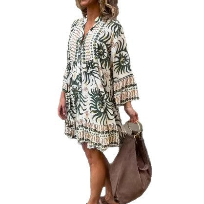 Women's lightweight viscose tunic with buttoned placket, gathered empire waist, elastic sleeve cuffs, and ruffle tiers StylebySassy