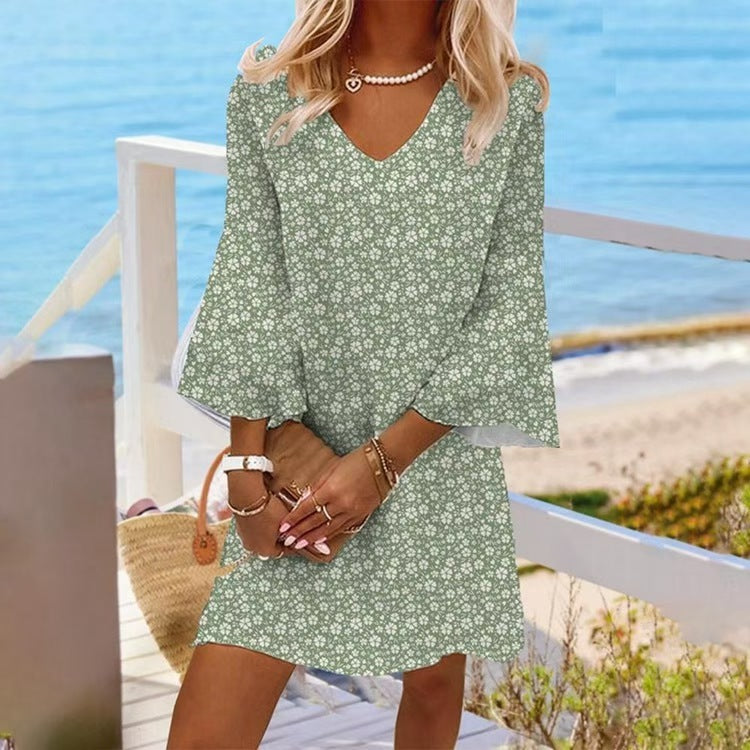 Women's light floral V-neck mini dress with bell sleeves and A-line cut StylebySassy