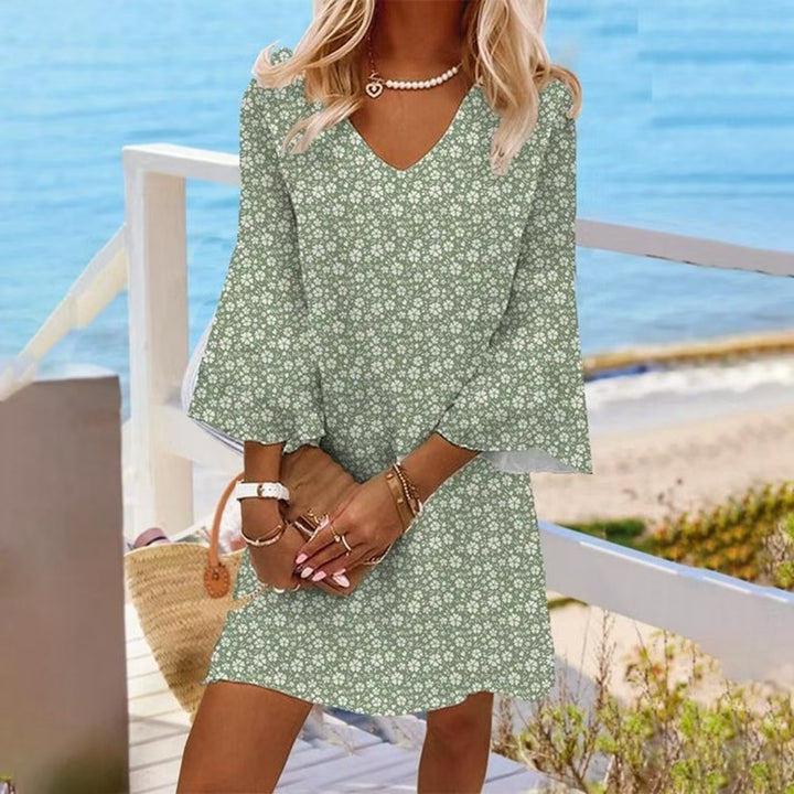 Women's light floral V-neck mini dress with bell sleeves and A-line cut StylebySassy