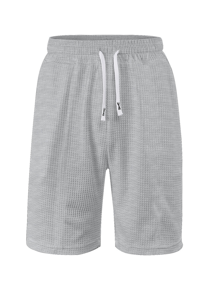 Men's breathable waffle pajama shorts with elastic comfort waistband, drawstring, and side pockets StylebySassy