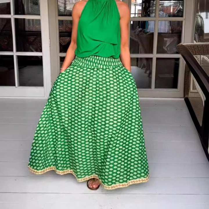 Women's two-piece halter neck set with gathered stand collar and patterned maxi skirt with elastic smocked waistband StylebySassy