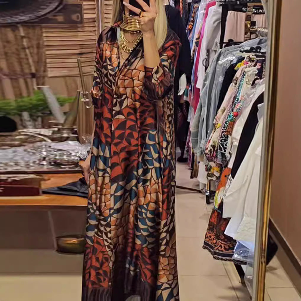 Women's flowing satin shirt dress with shirt collar, geometric mosaic print, and casual maxi length StylebySassy