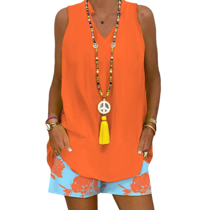 Women's sleeveless V-neck long top with curved hem and side insertion pockets StylebySassy