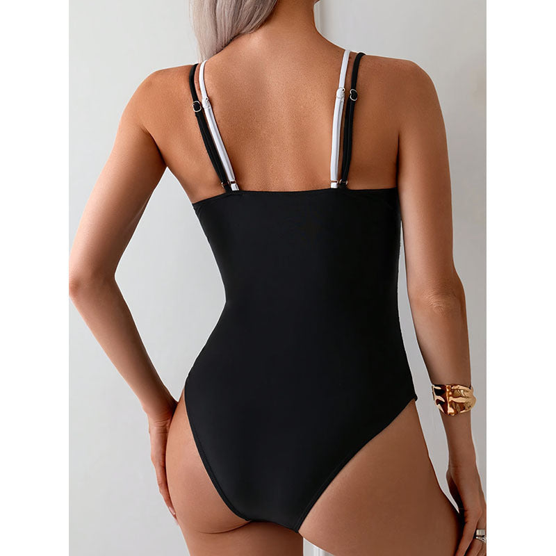 Women's one-piece swimsuit with a deep V-neckline and contrasting straps StylebySassy