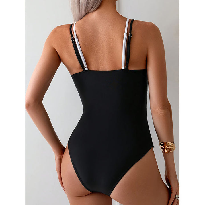 Women's one-piece swimsuit with a deep V-neckline and contrasting straps StylebySassy