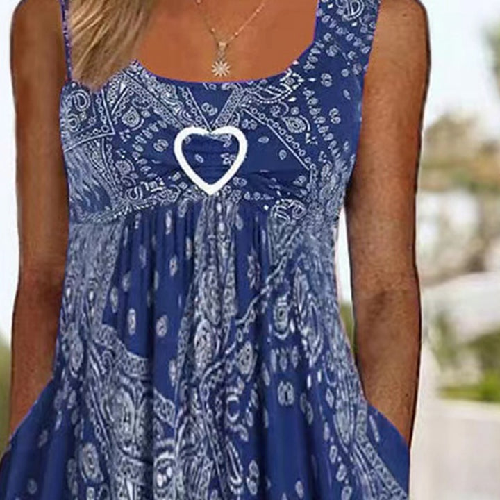 Women's airy maxi dress with paisley bandana print, gathered empire waist and practical side pockets StylebySassy
