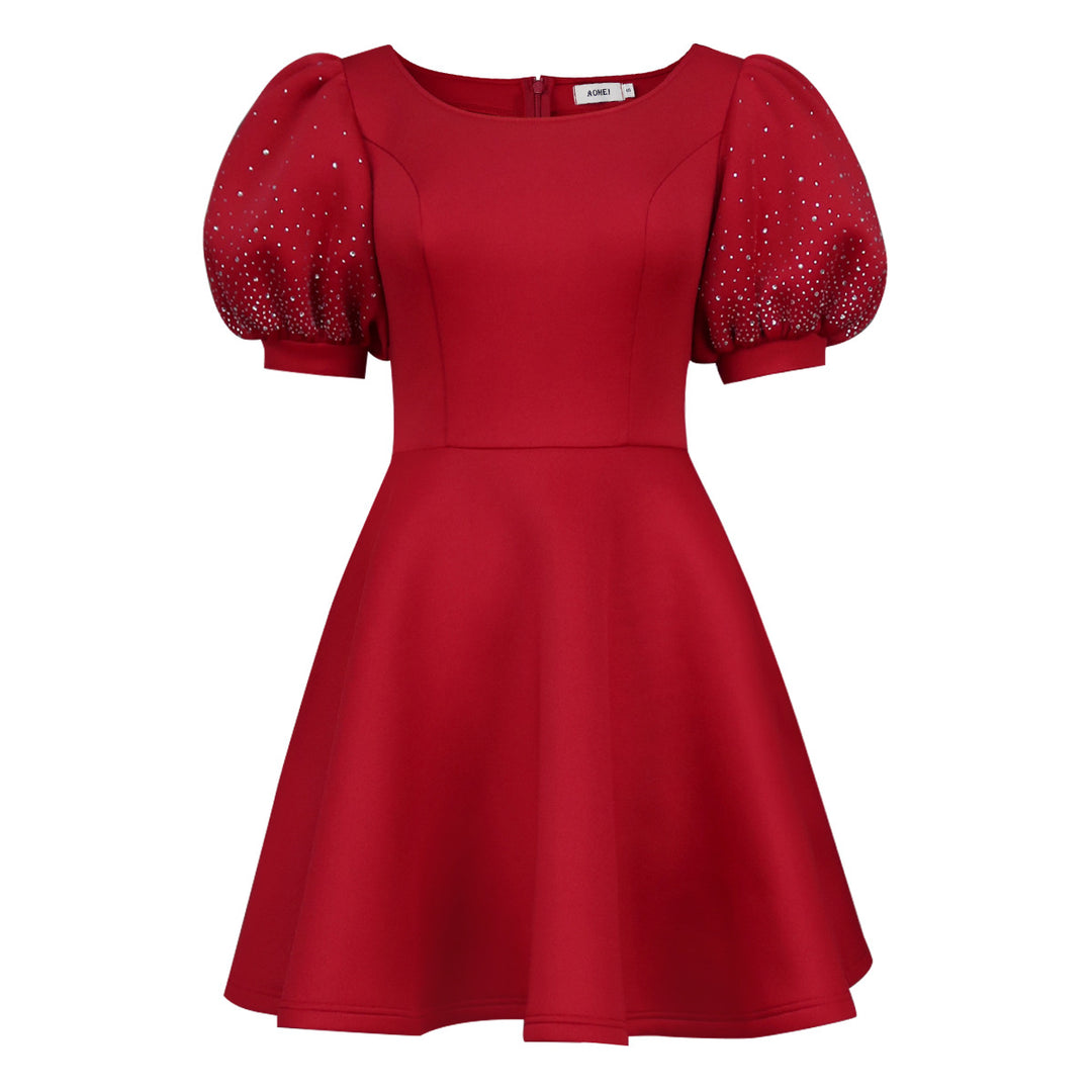 Women's cocktail dress with voluminous puff sleeves and shimmering accents StylebySassy