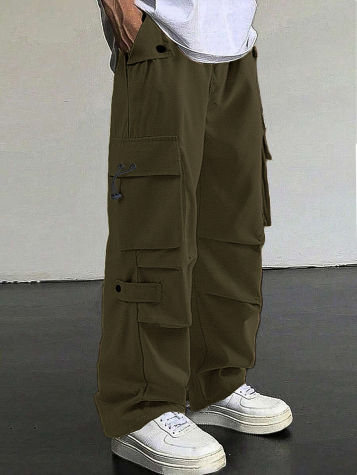 Men's baggy cargo pants with utilitarian flap pockets, drawstring waistband, and reinforced seams StylebySassy