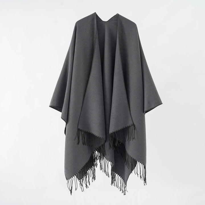 Women's fashionable fringe poncho made of soft material with luxurious drape StylebySassy