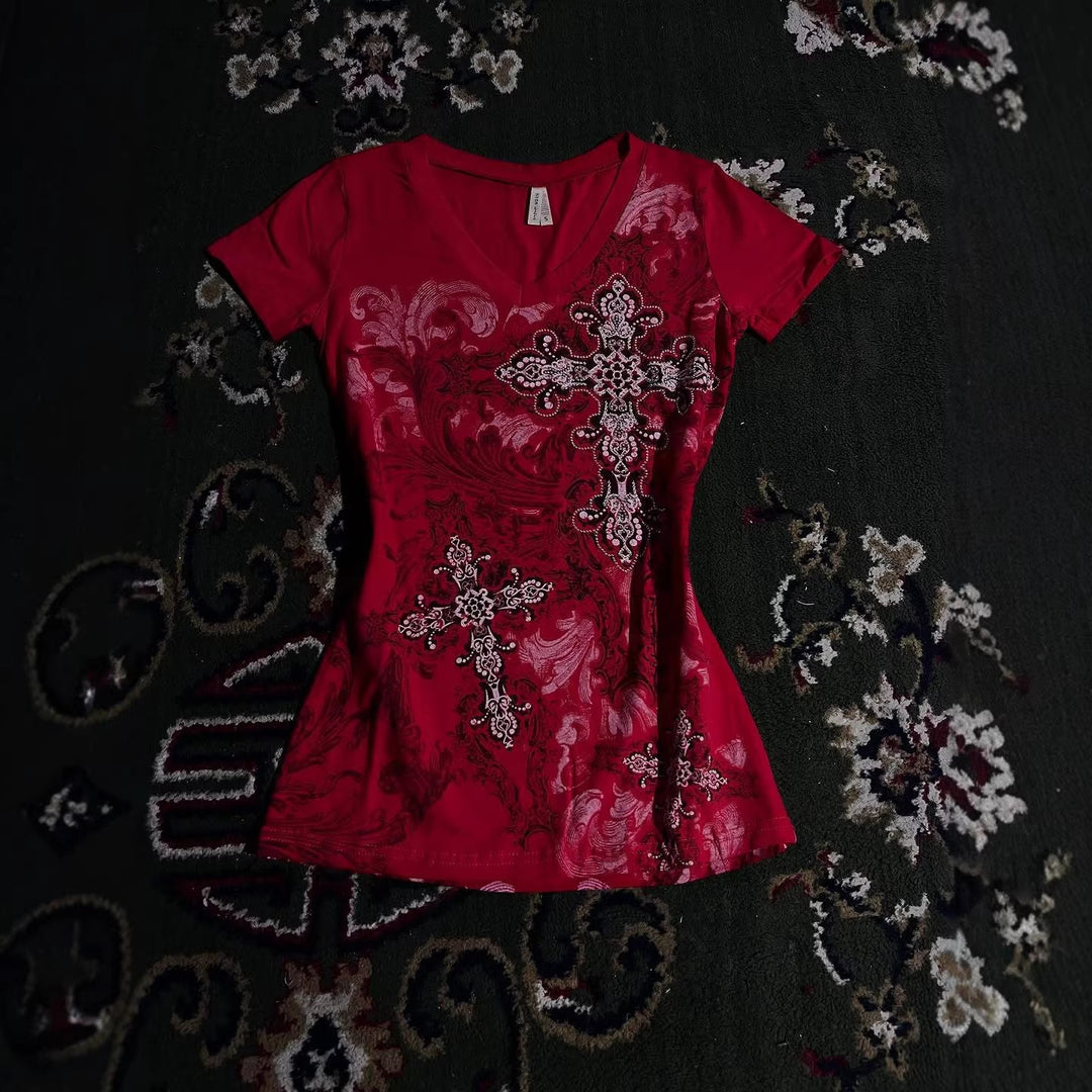 Women's T-shirt with decorative cross design and floral accents StylebySassy