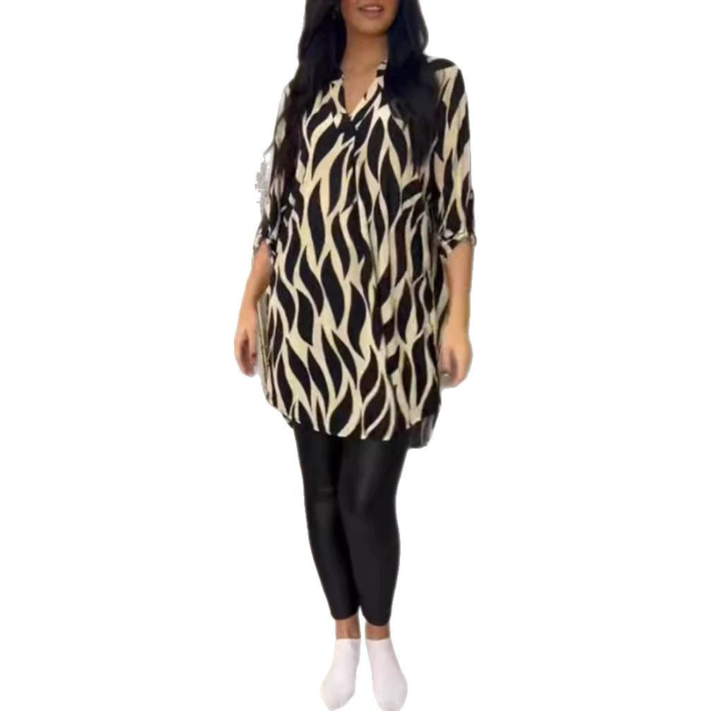 Women's oversized tunic blouse with organic leaf print, V-neckline, half button placket, and rounded hem StylebySassy