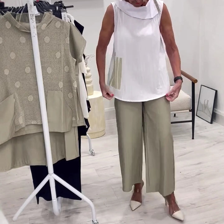 Women's sleeveless blouse top with wide shawl collar, relaxed A-line and side decorative yoke StylebySassy