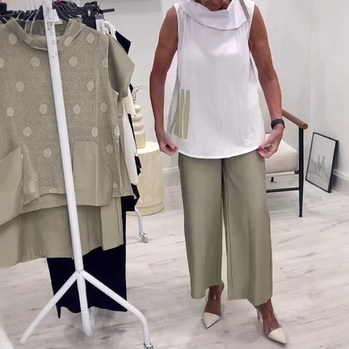 Women's sleeveless blouse top with wide shawl collar, relaxed A-line and side decorative yoke StylebySassy
