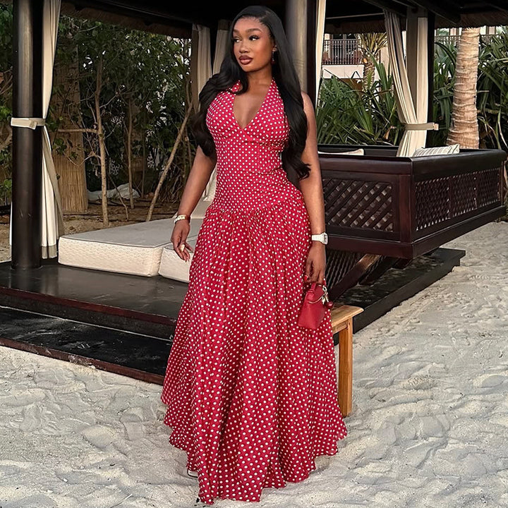 Ladies long halter dress with deep V-neck, tailored empire seam and flared layered skirt StylebySassy