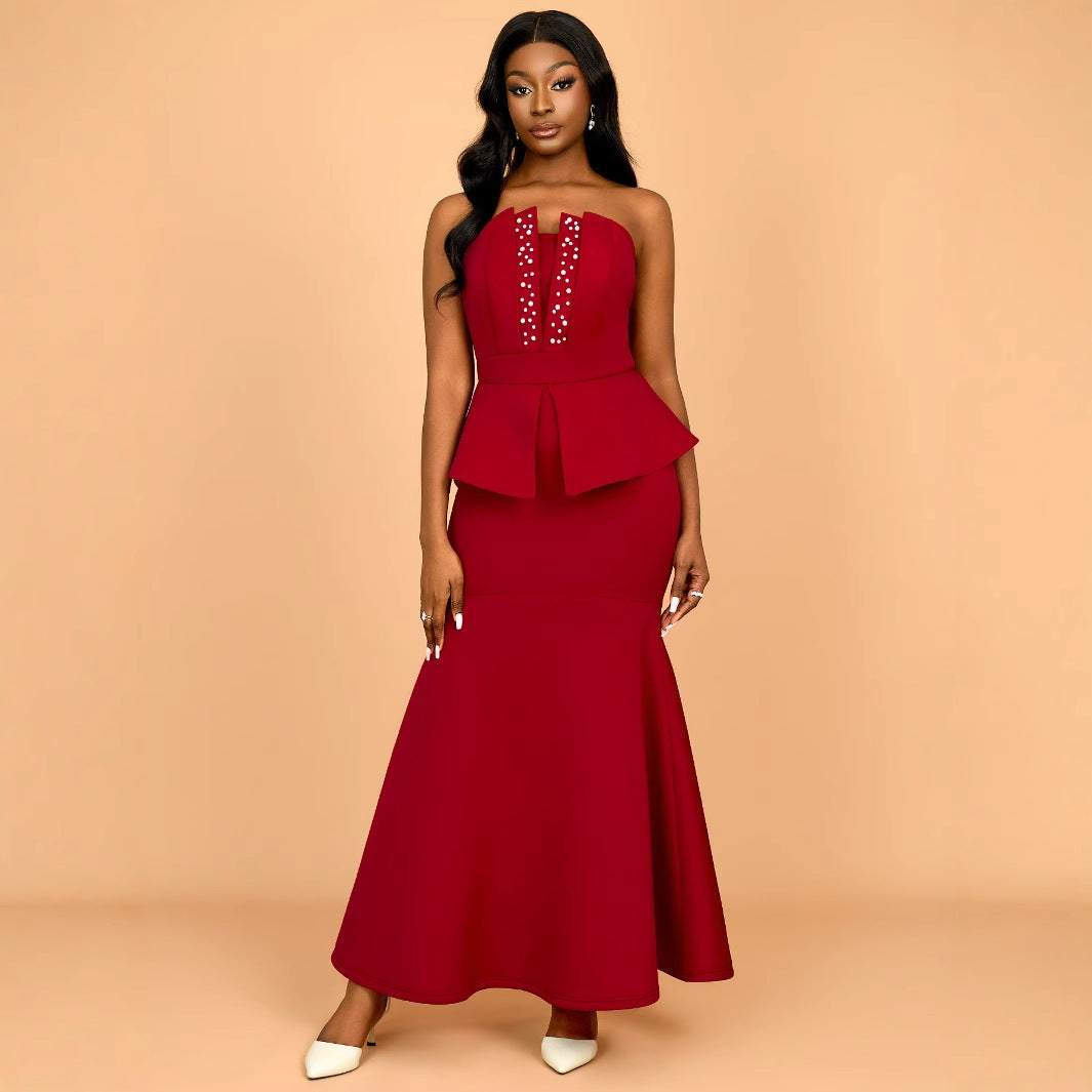 Women's evening dress with shimmering details and voluminous peplum drape