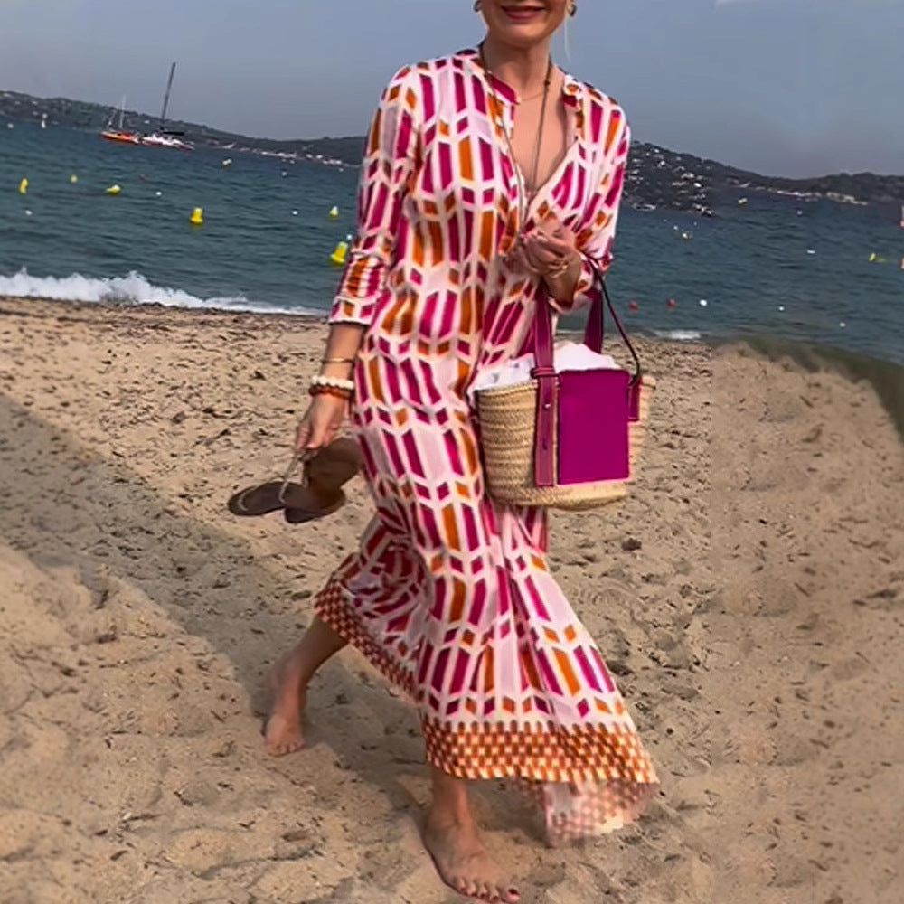 Women's flowing maxi dress with graphic all-over print, V-neck and three-quarter sleeves StylebySassy