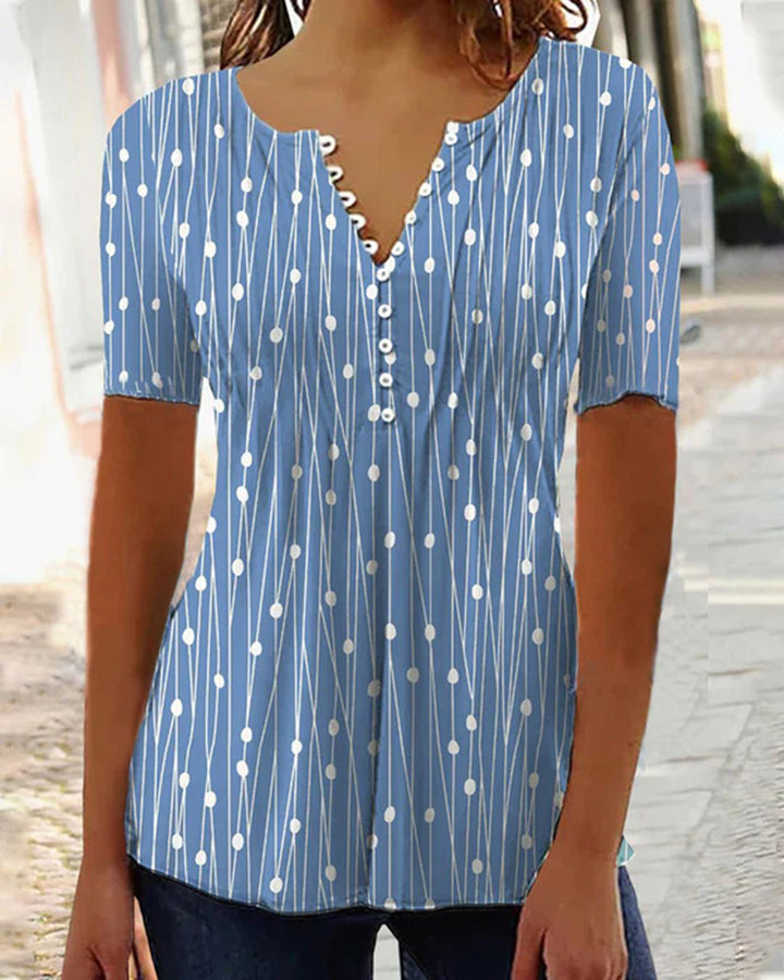 Women's airy V-neck blouse with short sleeves, decorative button placket and graphic dot stripe pattern StylebySassy