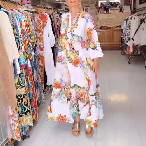 Women's airy maxi dress in layered look with V-neck, button placket, and three-quarter bell sleeves StylebySassy