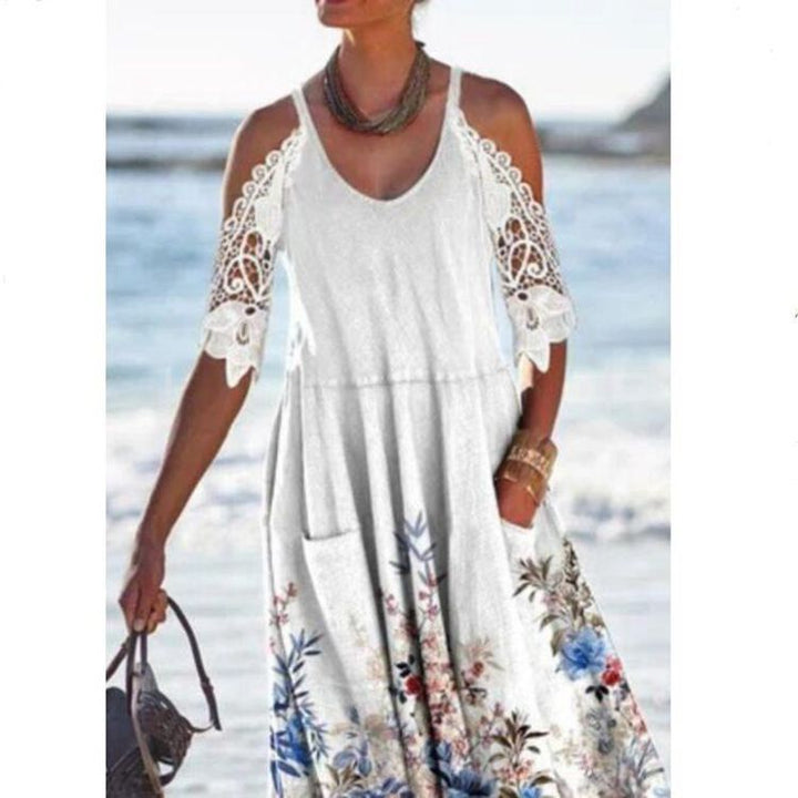 Women’s flowing maxi dress with shoulder cutouts crochet lace sleeves A-line cut and side pockets StylebySassy