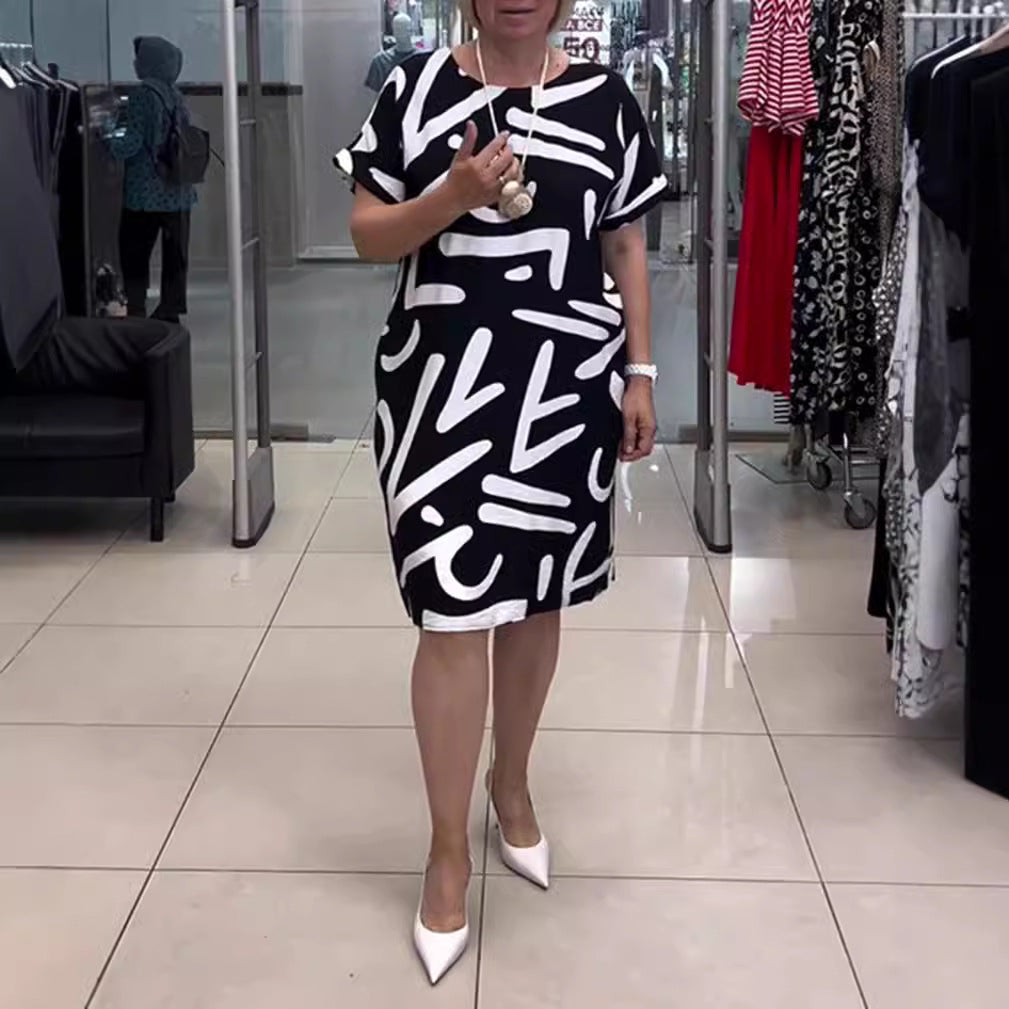 Women knee-length comfort shift dress with large brush stroke print and rolled short sleeves StylebySassy