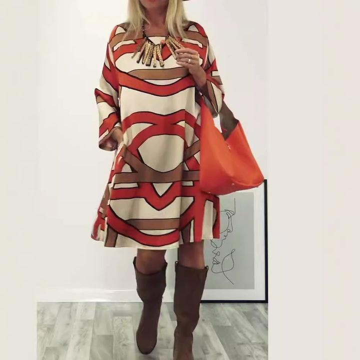 Women's generous swing dress with wide tulip hem, batwing sleeves and graphic all-over pattern StylebySassy
