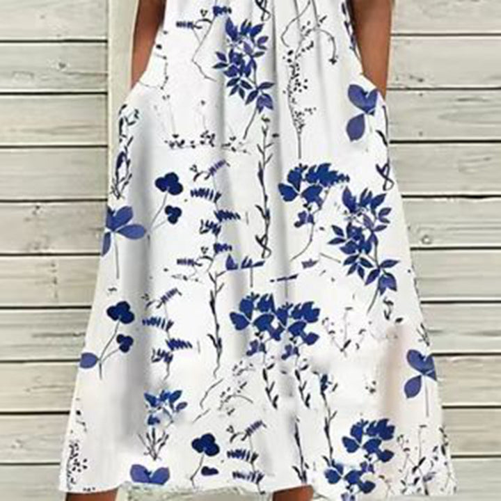 Ladies' airy A-line midi dress with lace sleeves, side pockets, and round neckline StylebySassy