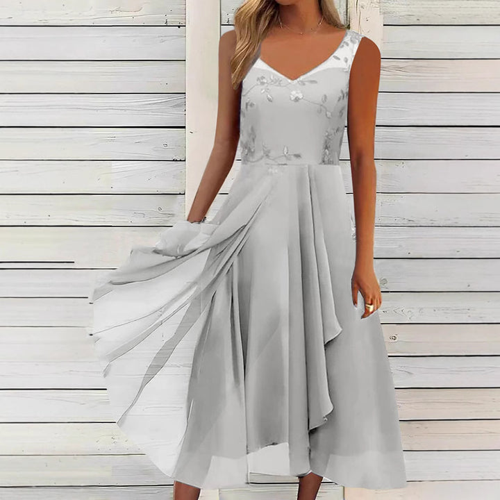 Women A-line chiffon dress with floral embroidered bodice, V-neck, draped godet swing and concealed side pockets StylebySassy