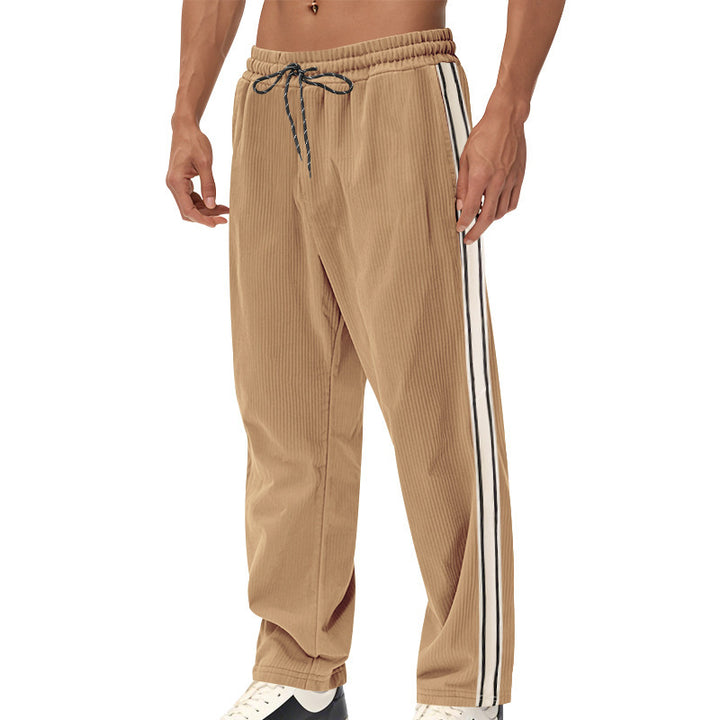 Men's loose training pants in corduroy look with drawstring waistband and side contrast stripes StylebySassy