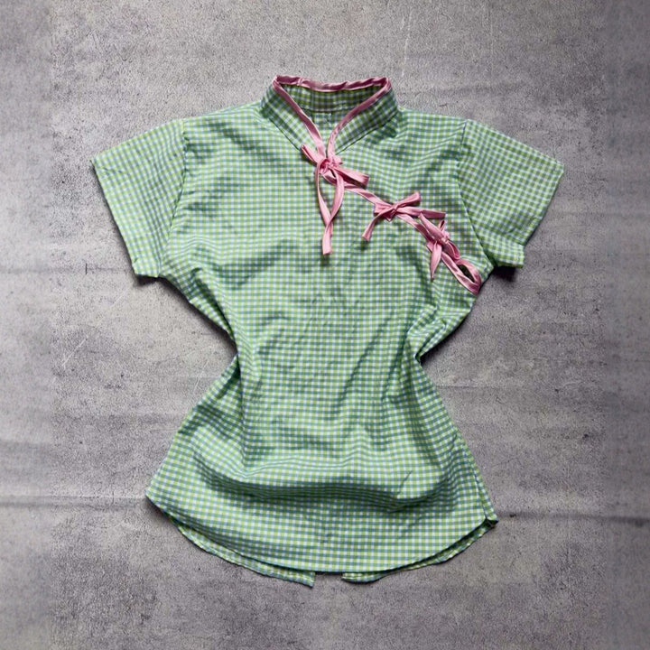 Women’s Chinese short-sleeve shirt with playful check pattern and decorative bows