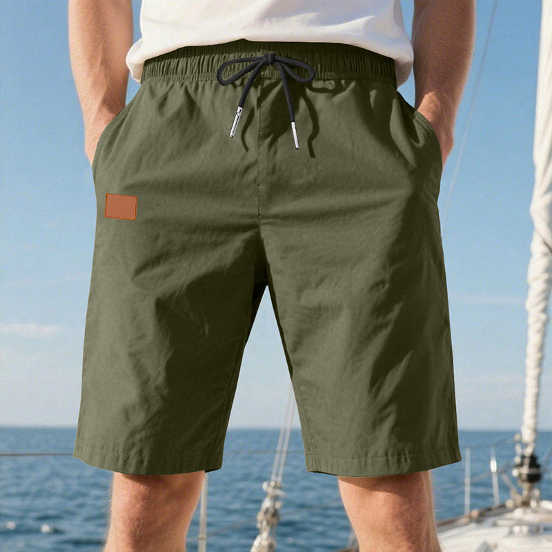 Men's quick-drying swim shorts in Bermuda cut with elastic waistband and drawstring StylebySassy