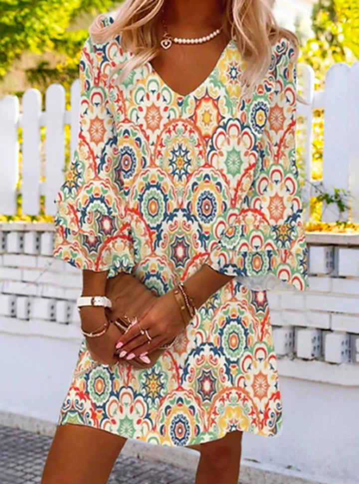 Women's short tunic dress with V-neck, three-quarter bell sleeves and ornamental mandala print StylebySassy