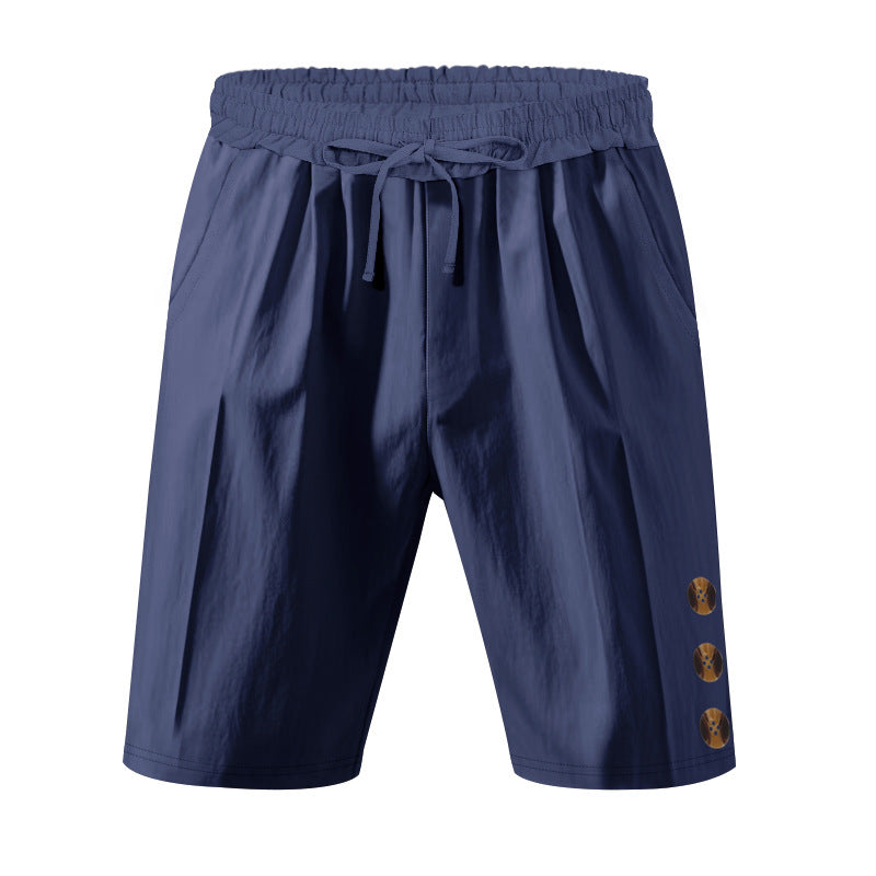 Men's knee-length casual Bermuda shorts with elastic tunnel drawstring waist, side slit pockets, and round decorative appliqués StylebySassy
