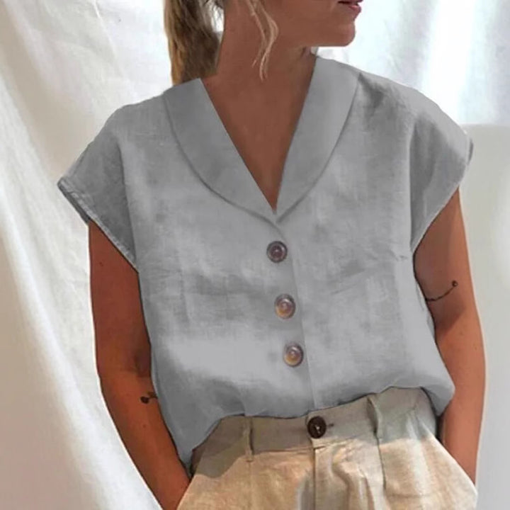 Women's airy linen blouse with wide V-neck, dropped shoulder and decorative button placket StylebySassy