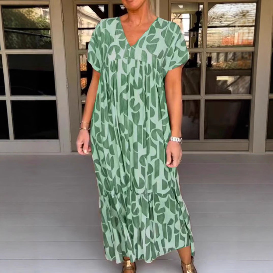 Women's voluminous maxi dress with under-bust seam, V-neck, short kimono sleeves, and tiered ruffle StylebySassy