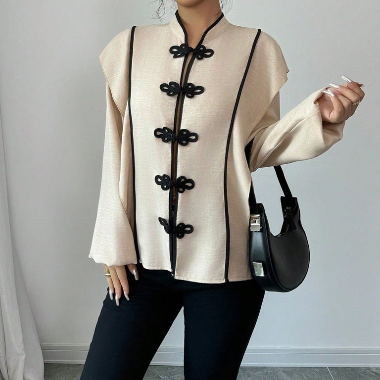 Women's stand-up collar blouse with decorative knot closures and decorative piping StylebySassy