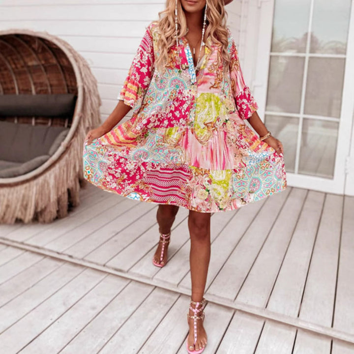 Ladies' airy tiered dress in patchwork boho style with stand collar, gathered waist seam, and three-quarter sleeves StylebySassy